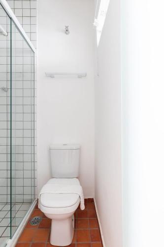a bathroom with a toilet and a shower at ZEST Pedroso in Sao Paulo