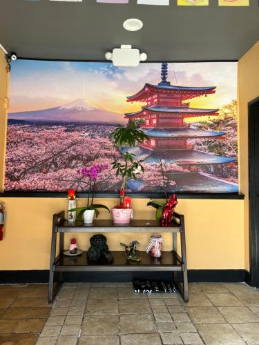 a wall with a mural of a pagoda at La Quinta by Wyndham San Francisco Airport West Millbrae FREE AIRPORT SHUTTLE in Millbrae