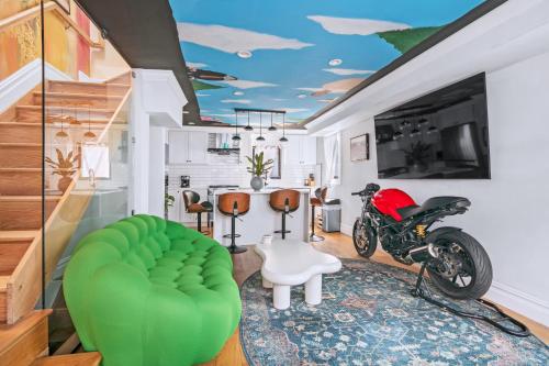 a living room with a motorcycle and a table with a couch at *RARE* Free Parking - Sailor Moon HSE Williamsburg in Brooklyn