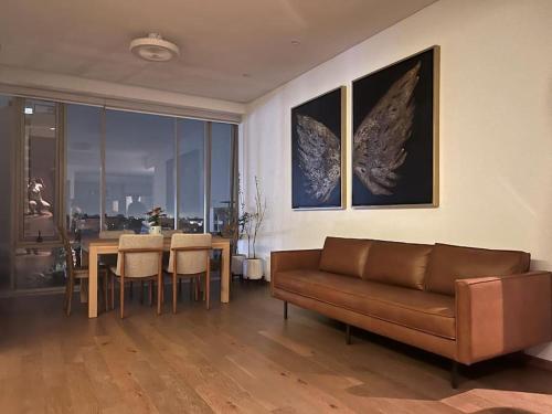 a living room with a couch and a table at Olivo&Laurel HP - Sur in Mexico City