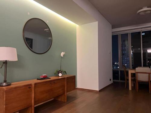 a living room with a mirror on the wall at Olivo&Laurel HP - Sur in Mexico City
