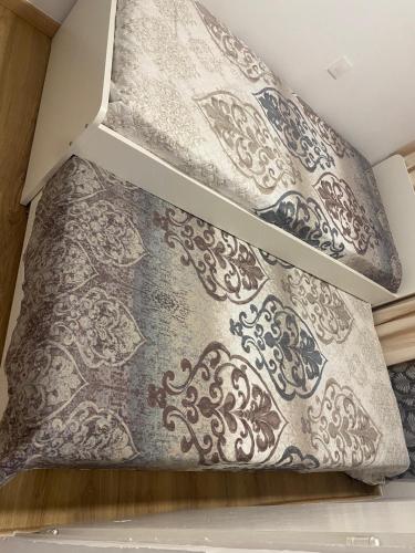 two pillows sitting on top of a bed at Casa en empuriabrava in Empuriabrava