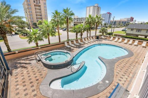 a swimming pool with a slide in a resort at Crystal Tower 206 Amenities galore in Gulf Shores