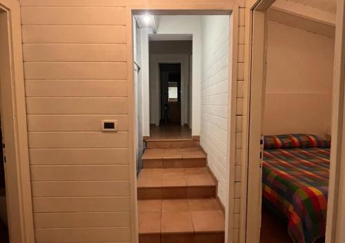 a hallway with a closet with a bed in it at Villa Marlene Casa vacanze in parco privato in Monterusciello