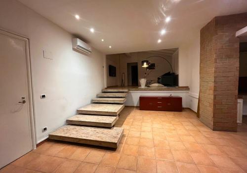 a room with stairs and a bathroom with a sink at Villa Marlene Casa vacanze in parco privato in Monterusciello