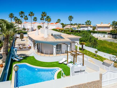 an aerial view of a house with a swimming pool at Vicente Mar Luxury Villa - Private Pool in Albufeira