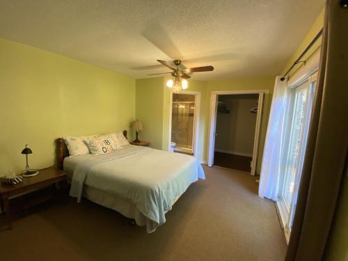 a bedroom with a bed and a ceiling fan at HB GUEST HOME 6 in Waterloo