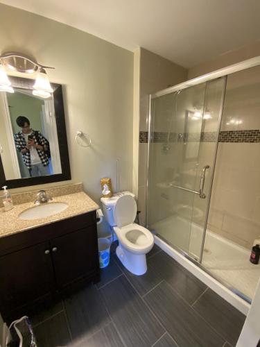 a bathroom with a shower and a toilet and a sink at HB GUEST HOME 6 in Waterloo