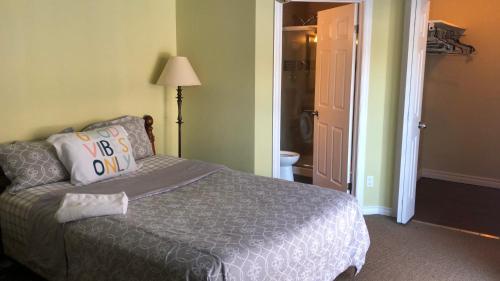 a bedroom with a bed and a door to a bathroom at HB GUEST HOME 6 in Waterloo