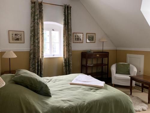 a bedroom with a bed with a book on it at Itha’s secret escape in Langschlag