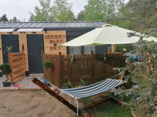 a hammock in front of a moroccan bar at Domek MODERN BARN- 4 tylko 800m od Suntago Ranczo Gold Mania in Krzyżówka