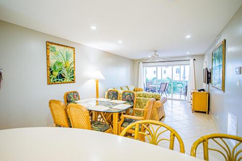 a dining room with a table and chairs at Seven Mile Beach Resort in George Town