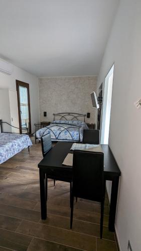 Postel nebo postele na pokoji v ubytování L' Arco Rosa
