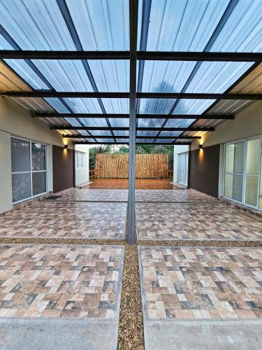 a room with a glass ceiling with a patio at Posadas Fratelli in Salta