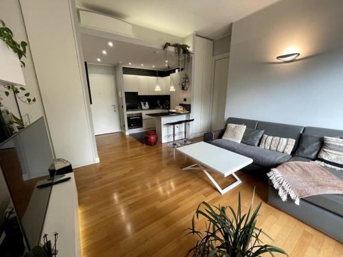 a living room with a couch and a table at VaticanoDreamSuite in Rome