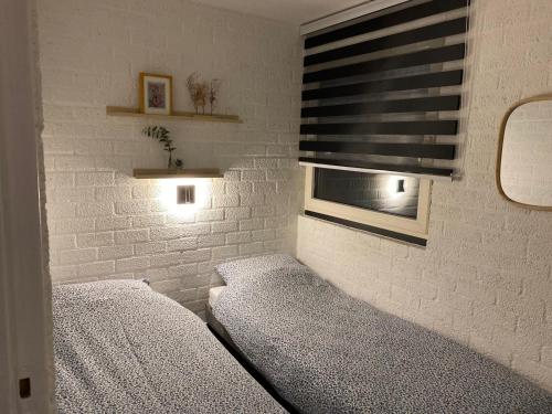 Ένα ή περισσότερα κρεβάτια σε δωμάτιο στο Cosy 8 - Zuid-Limburg