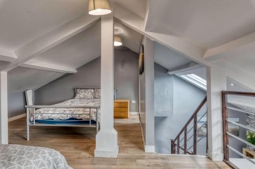a bedroom with a bed in a attic at Central Apartment Darlington in Darlington