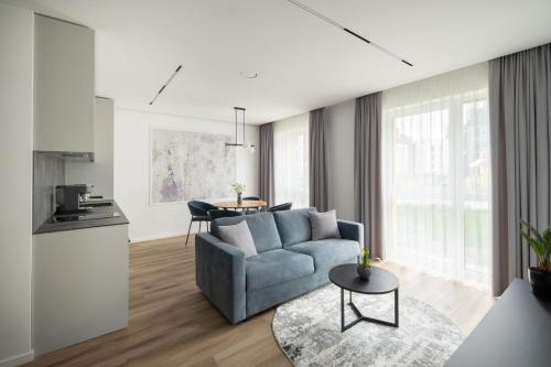 a living room with a couch and a table at No. 1 PARK AVENUE APARTMENT in Kaunas