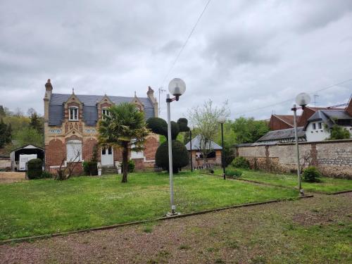 a house with two street lights in front of it at Maison FOCH in Évreux