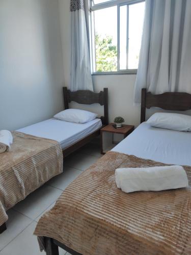 Ліжко або ліжка в номері Apartamento em Lauro de Freitas bem localizado