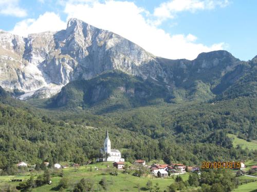 a church in the middle of a mountain at Rooms Pri Lovrižu in Kobarid
