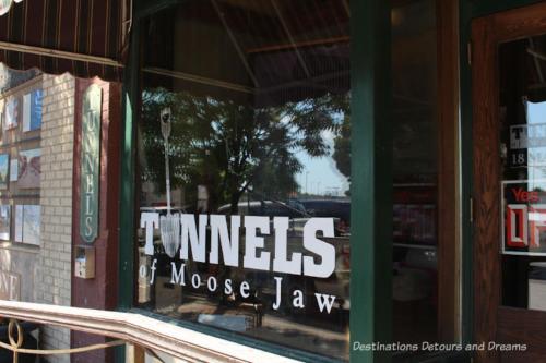 a sign in the window of a store at Large 1-bedroom Condo l Downtown l WiFi & Smart TV in Moose Jaw