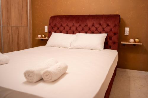 Säng eller sängar i ett rum på Kostis Luxury Apartment