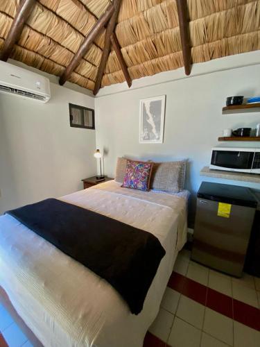 a bedroom with a large bed in a room at Studio Candelero en Loreto in Loreto