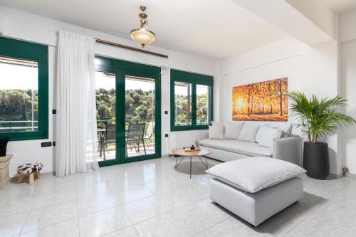 a living room with a couch and a table at Villa Giannari in Stalos