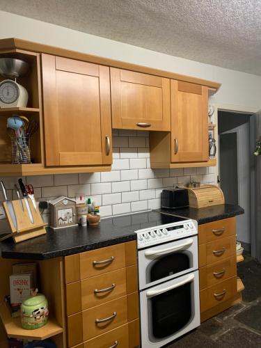 Kuchyň nebo kuchyňský kout v ubytování Cobblers Cottage