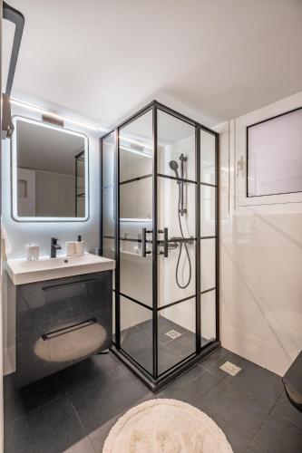 a bathroom with a shower and a sink at Charmant in Athens