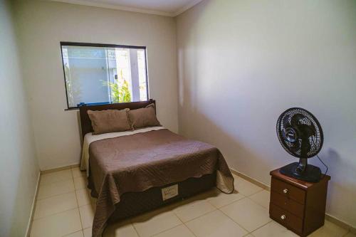 Katil atau katil-katil dalam bilik di Casa com Wi-Fi a 200m da Praia do Coqueiro PI