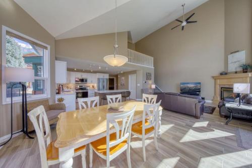 a dining room and living room with a table and chairs at Marble Canyon in Fairmont Hot Springs