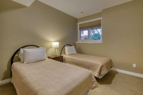 a bedroom with two beds and a window at Marble Canyon in Fairmont Hot Springs