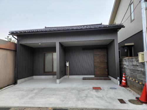 a house with a garage with a driveway at Toyama - House - Vacation STAY 19675v in Toyama