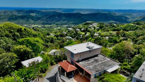 an aerial view of a house in the mountains at Camino Al Cielo in Guayanilla