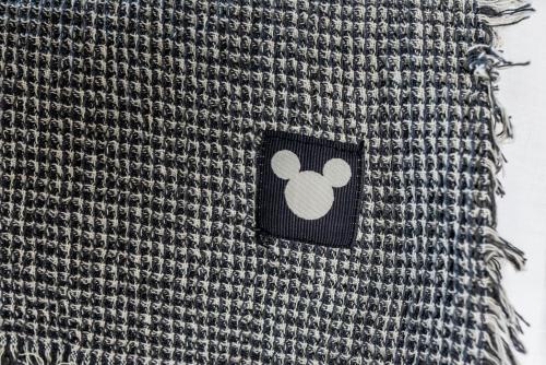 a sticker on the side of a bag with a mouse on it at Blue Hug Apartments in Plataria