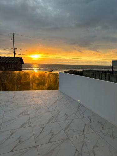 a view of the sunset from the roof of a house at Villasrock2022 in San Clemente