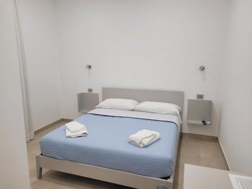 Postel nebo postele na pokoji v ubytování Gemini rooms