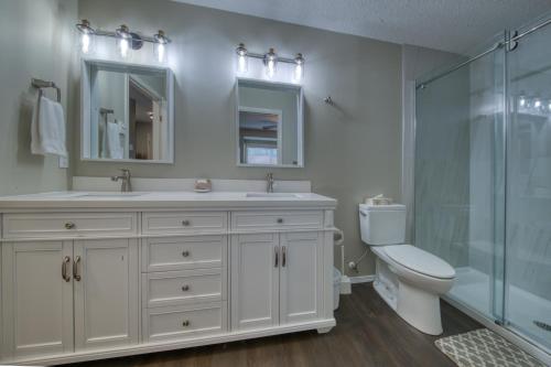 a bathroom with a toilet and a sink and a shower at Marble Canyon in Fairmont Hot Springs