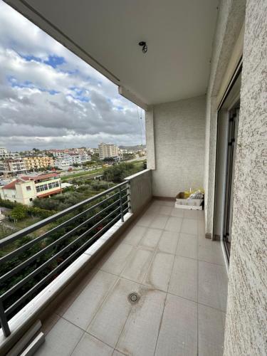 a balcony of a building with a view of a city at Cozy and Comfortable Apartment 2 in Durrës