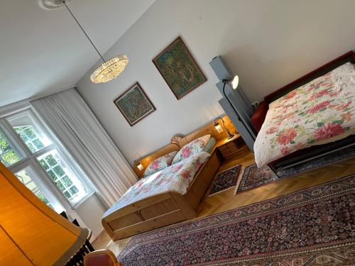 a small bedroom with a bed and a window at Villa Pazelt Top4 in Bad Vöslau