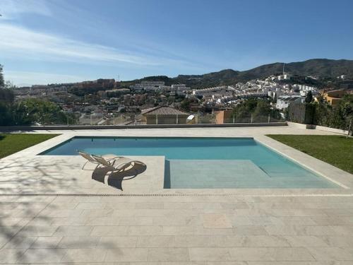 a swimming pool with a butterfly painted on it at apartamento piscina privada in Rincón de la Victoria