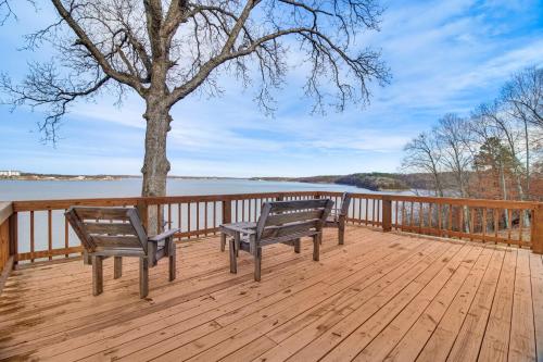 two benches sitting on a wooden deck with a tree at Grand Lake Views Pet-Friendly Jay Getaway! in Jay