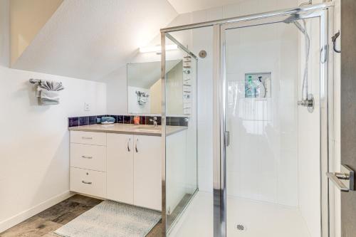 a bathroom with a shower and a sink at Depoe Bay Townhome with Deck and Stunning Ocean Views! in Depoe Bay