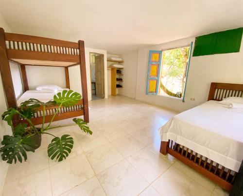 Postel nebo postele na pokoji v ubytování EcoHotel Casa Maria Parda