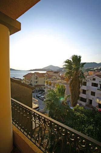 a balcony with a view of a city at Garni Hotel Meduza in Rafailovici