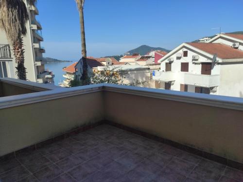 a balcony with a view of the city at Garni Hotel Meduza in Rafailovici