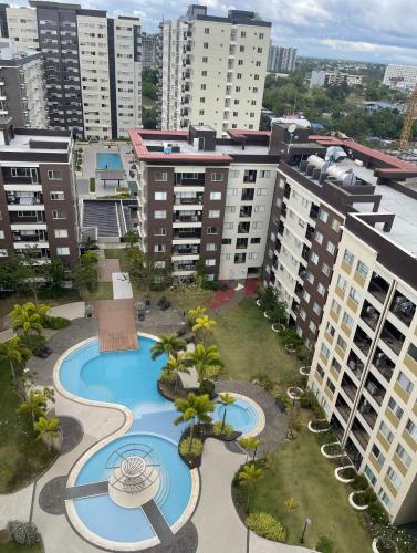 an aerial view of a resort with a pool and buildings at Iloilo Travellers Zen Zone in Iloilo City