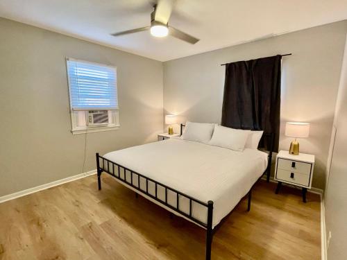 a bedroom with a bed and a window at Cathedral 1-Walking Distance to UNMC in Omaha